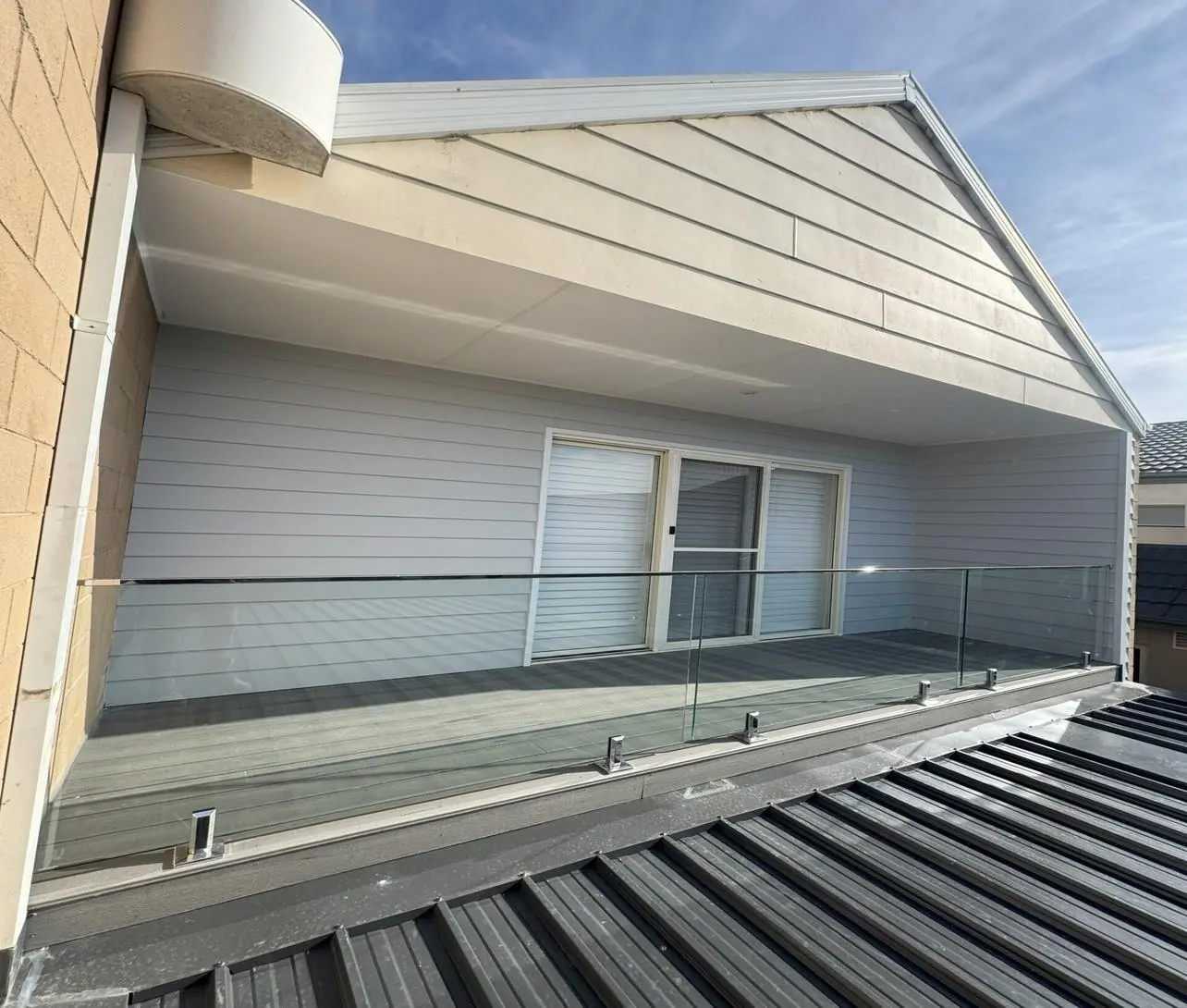 Upper-level balcony with glass balustrade