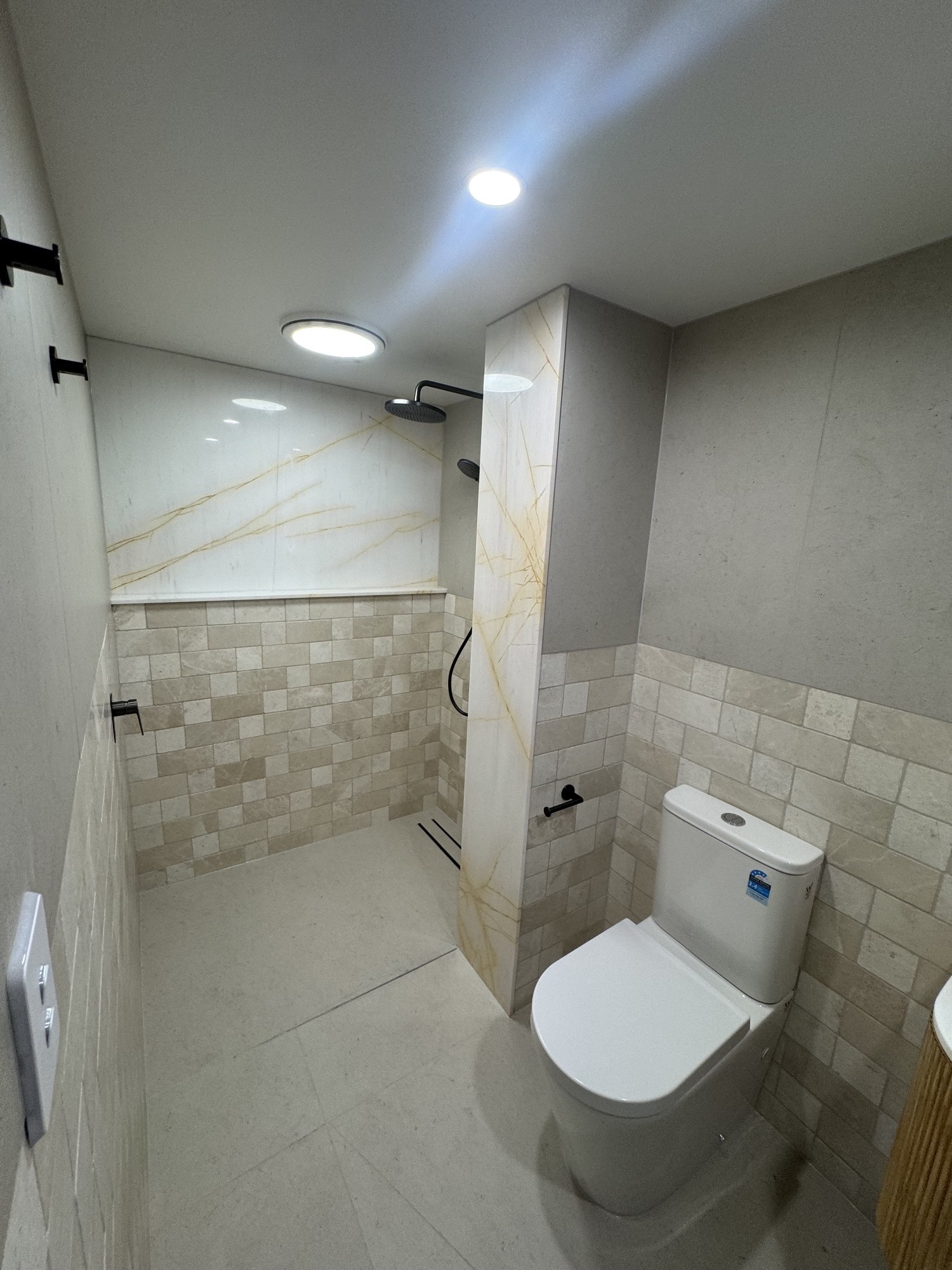 Bathroom shower side with stone wall tile