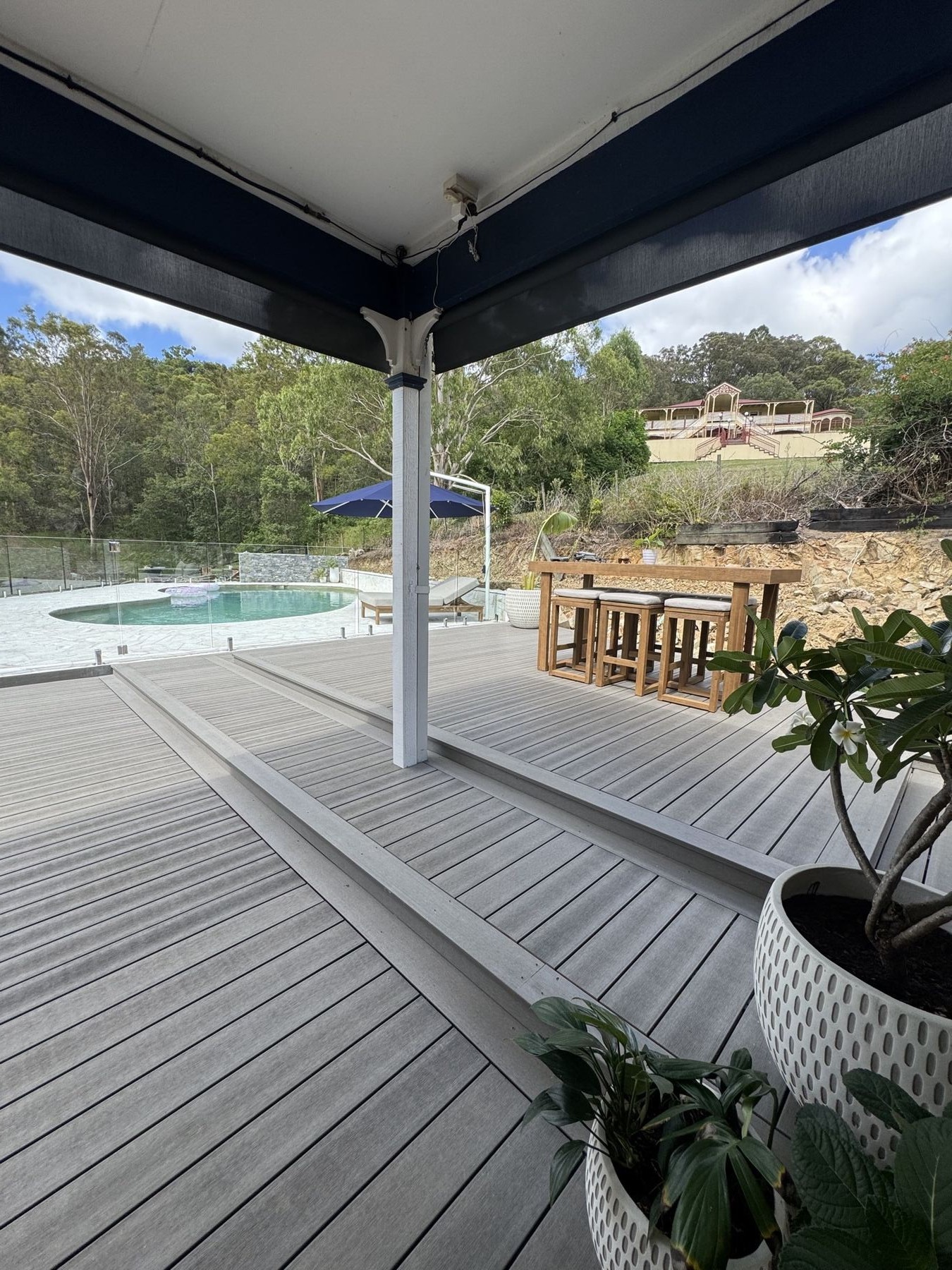 Composite deck with glass balustrade and acreage view