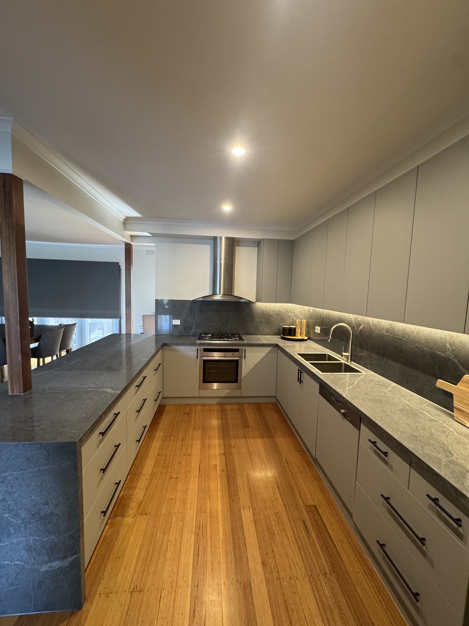U-shape kitchen length view with stone benchtop