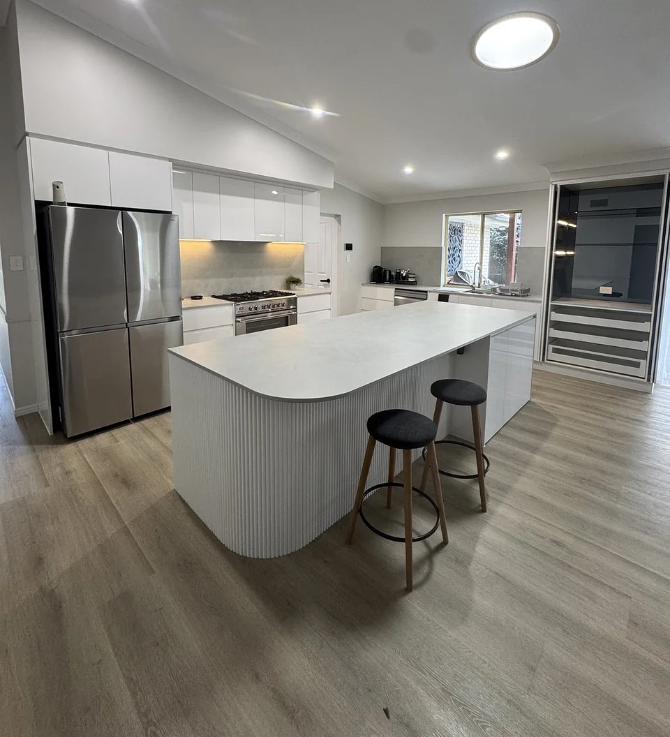 Completed kitchen renovation at Wellington Point with stone island and integrated appliances