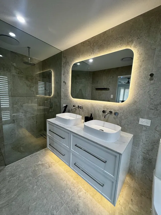 Ensuite with a double vanity and backlit mirror from the Wellington Point whole-home renovation